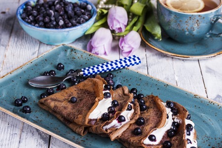 chocolate crepes with cream cheese and blueberries for Breakfastの写真素材