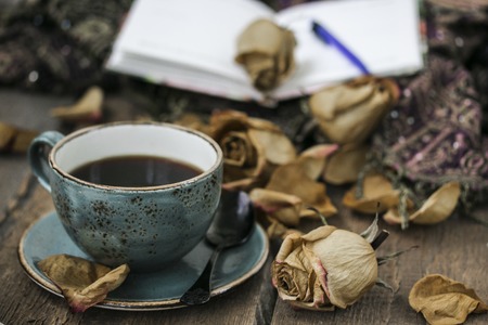 Cup of coffee, dry rose. Vintage still lifeの写真素材