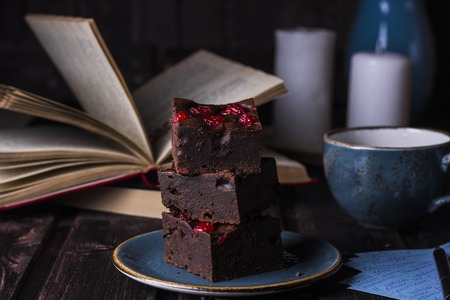 homemade chocolate brownies with cherries on dark backgroundの写真素材