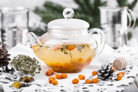 tea with sea-buckthorn berries, cloudberries and honeyの写真素材