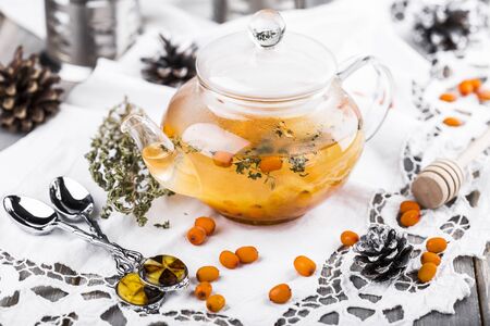 tea with sea-buckthorn berries, cloudberries and honeyの写真素材