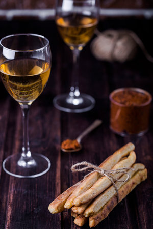 cheesy breadsticks with chili and thyme in a basket