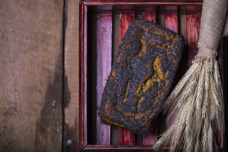 Fresh homemade poppy seed bread on a dark backgroundの写真素材