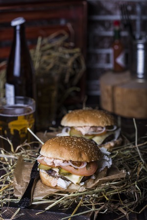 Fresh homemade burger closeup on wooden tableの写真素材