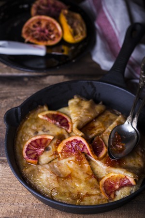 Crepe suzette, traditional french pancakes with orange syrupの写真素材