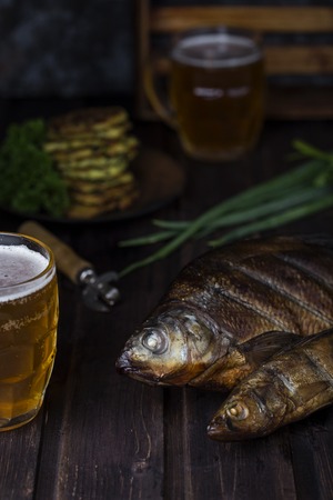smoked river fish on a dark backgroundの写真素材