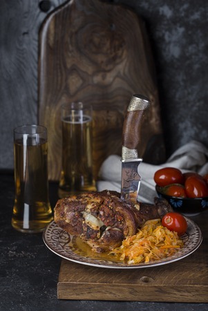 Pork knuckle with beer and sauerkraut. Oktoberfest still lifeの写真素材