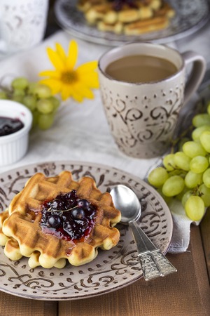 delicious breakfast with homemade Belgian waffles and berriesの写真素材
