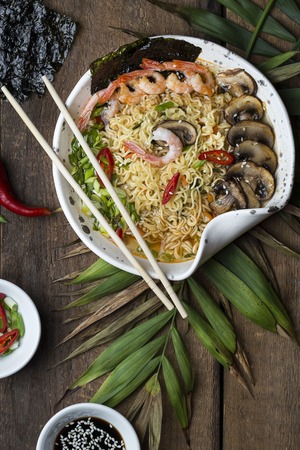 Asian noodles with shrimp , mushrooms and vegetablesの写真素材
