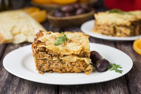 Homemade meat lasagna on wooden tableの写真素材