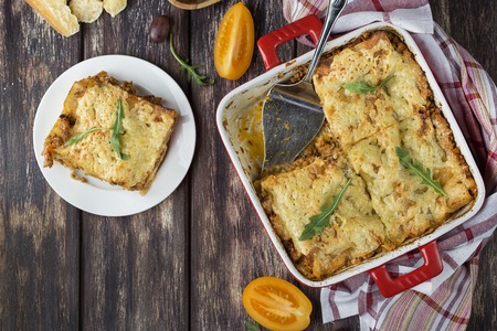 Homemade meat lasagna on wooden tableの写真素材