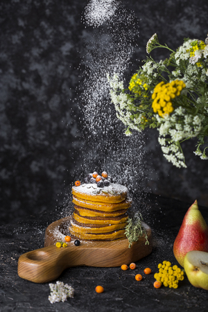 stack of pumpkin pancakes with cinnamon and honeyの写真素材