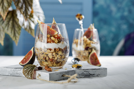 dessert with granola and Greek yogurt in glassesの写真素材