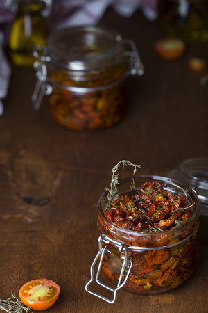Sun dried tomatoes with herbsの写真素材
