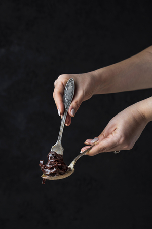 chocolate tagliatelle pasta on a dark backgroundの写真素材