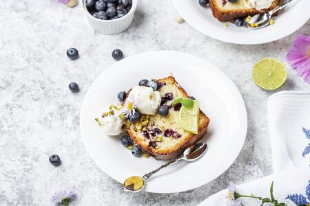 Homemade fresh blueberry butter cake with lime and nutsの写真素材