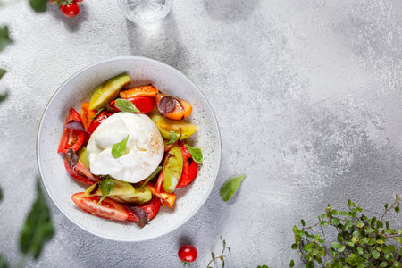 Burrata cheese with Basil leaves and tomatos. Caprese salad