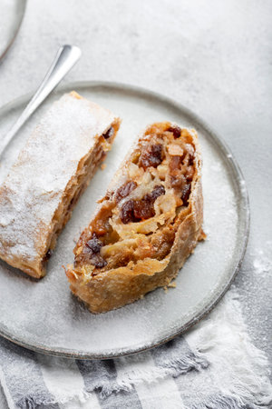 homemade apple strudel with walnut and sugar powder