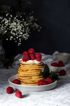 homemade pancakes with fresh raspberry and sour creamの写真素材
