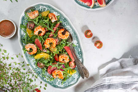 salad with shrimps, arugula, tomatoes and citrus fruitsの写真素材