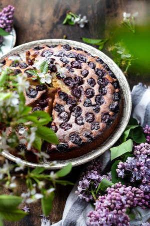 homemade cake with cherries, ricotta and powdered sugarの写真素材