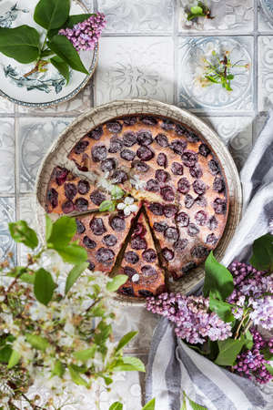 homemade cake with cherries, ricotta and powdered sugarの写真素材