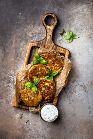 zucchini and parmesan fritter with tzatziki sauceの写真素材