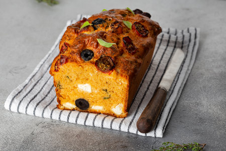 Savoury cake with tomatoes, olives and feta cheeseの写真素材