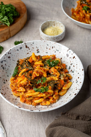 homemade pasta with meat ragu bolognese and kaleの写真素材