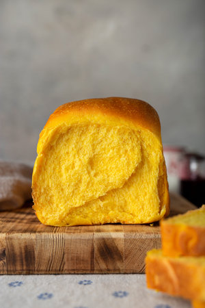 homemade yeast wheat carrot bread with butter and jam