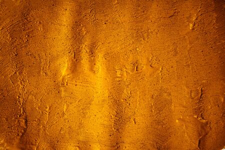 A beautiful Gold paint texture on wall, backgroundの写真素材