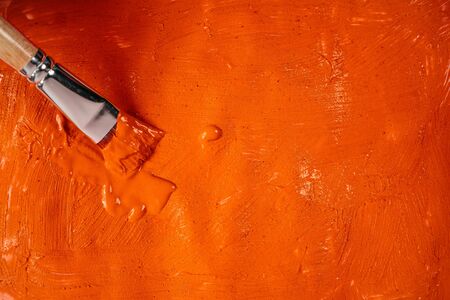 A beautiful Orange paint texture on wall, background - Image. Color paint strokes.の写真素材