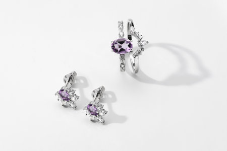 Elegant jewelry set. Jewelery set with gemstones. jewelry accessories collage. product still life concept. Ring, necklace and earrings.の写真素材