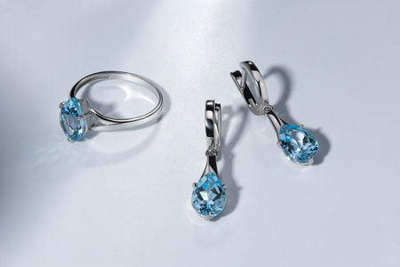 Elegant jewelry set. Jewelery set with gemstones. jewelry accessories collage. product still life concept. Ring, necklace and earrings.の写真素材