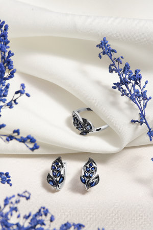 Elegant jewelry set. Jewelery set with gemstones. jewelry accessories collage. product still life concept. Ring, necklace and earrings.の写真素材