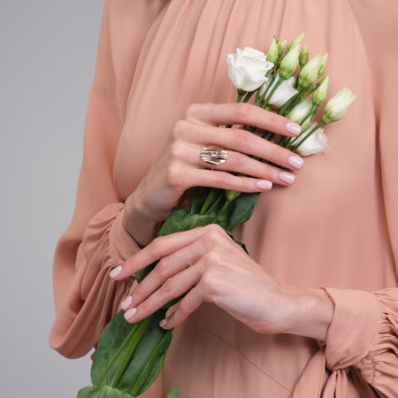 woman jewelry concept. Woman s hands close up wearing rings and necklace modern accessories elegant life style with copy space for text and background.の写真素材