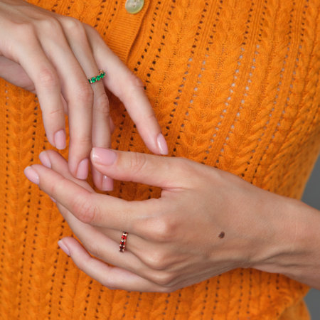 woman jewelry concept. Woman s hands close up wearing rings and necklace modern accessories elegant life style with copy space for text and background.の写真素材