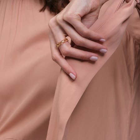 woman jewelry concept. Woman s hands close up wearing rings and necklace modern accessories elegant life style with copy space for text and background.の写真素材