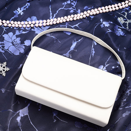 White women's clutch with a chain on a blue background top viewの写真素材