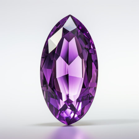 A stunning purple gemstone, featuring a captivating teardrop shape with brilliant facets that catch light beautifullyの写真素材