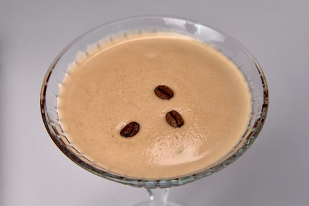 A Decadent Dessert Drink Featuring Creamy Coffee Flavors and Garnished with Coffee Beans, Perfect...