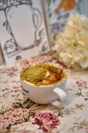 Delicious Dessert in a Cup: A Lusciously Layered Treat with Unique Textures and Flavors Perfect for Any Occasion, Adorned with Elegant Floral Surroundingsの写真素材