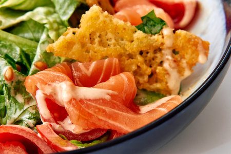 Fresh and Flavorful Salad Featuring Savory Smoked Salmon, Crisp Greens, and an Irresistible Creamy Dressing for a Deliciously Light Mealの写真素材