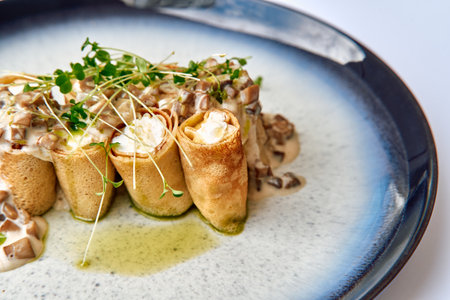 Delectable Crepe Rolls Filled with Creamy Filling and Garnished with Fresh Microgreens, Presented Elegantly on a Stylish Plateの写真素材