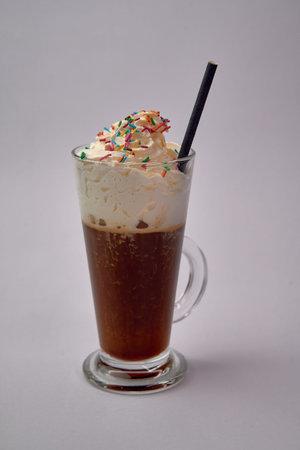 Delightful Ice Cream Beverage with Whipped Cream and Colorful Sprinkles for a Refreshing Summer...