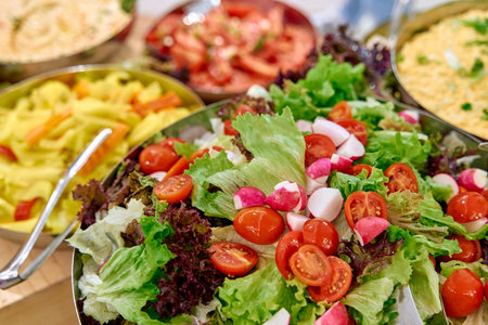 A Colorful Display of Fresh Salads Featuring Vibrant Greens, Cherry Tomatoes, and Radishes in an...
