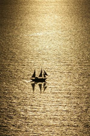 A sailboat under the sunshineの写真素材