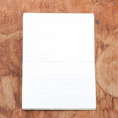 Sheet of paper on a piece of wood 