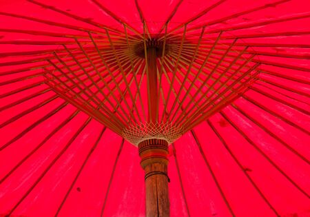 red umbrella is made of linen and bamboo.の写真素材