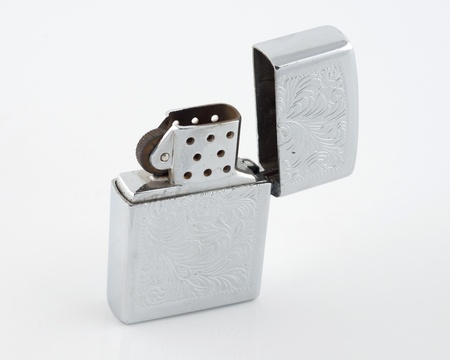 Silver lighter isolated on white background の写真素材